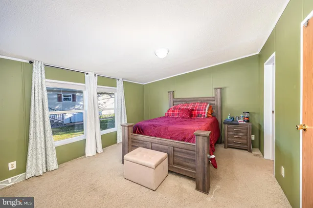 a bedroom with a bed and a cabinets