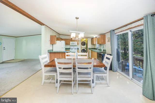 a dining room with furniture window and outside view