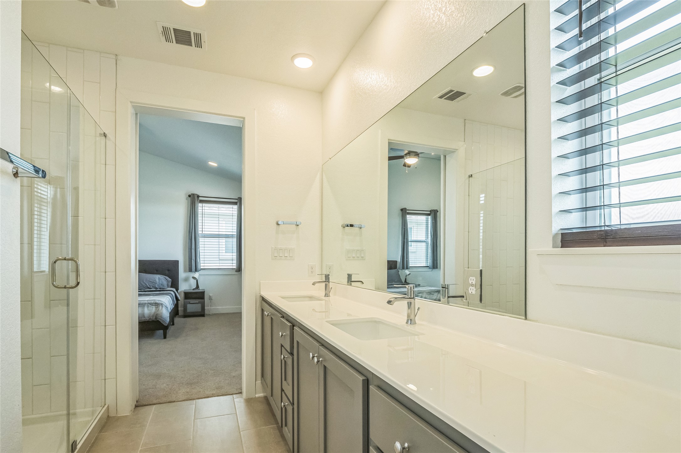 3706 Mesquite Vly Road Georgetown, TX 78628 - Photo 21 of 30 Ensuite bathroom with tile patterned flooring, a stall shower, double vanity, ceiling fan, and recessed lighting