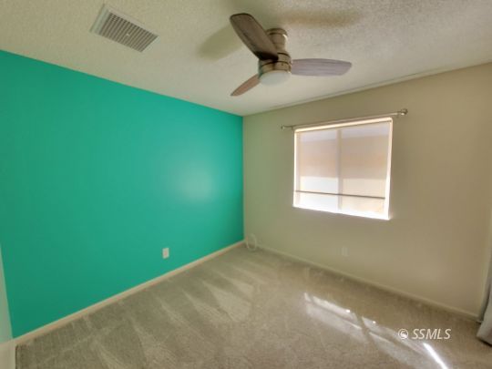 724 Ginger Avenue Ridgecrest, CA 93555 - Photo 10 of 21 a view of a room that has a window in it
