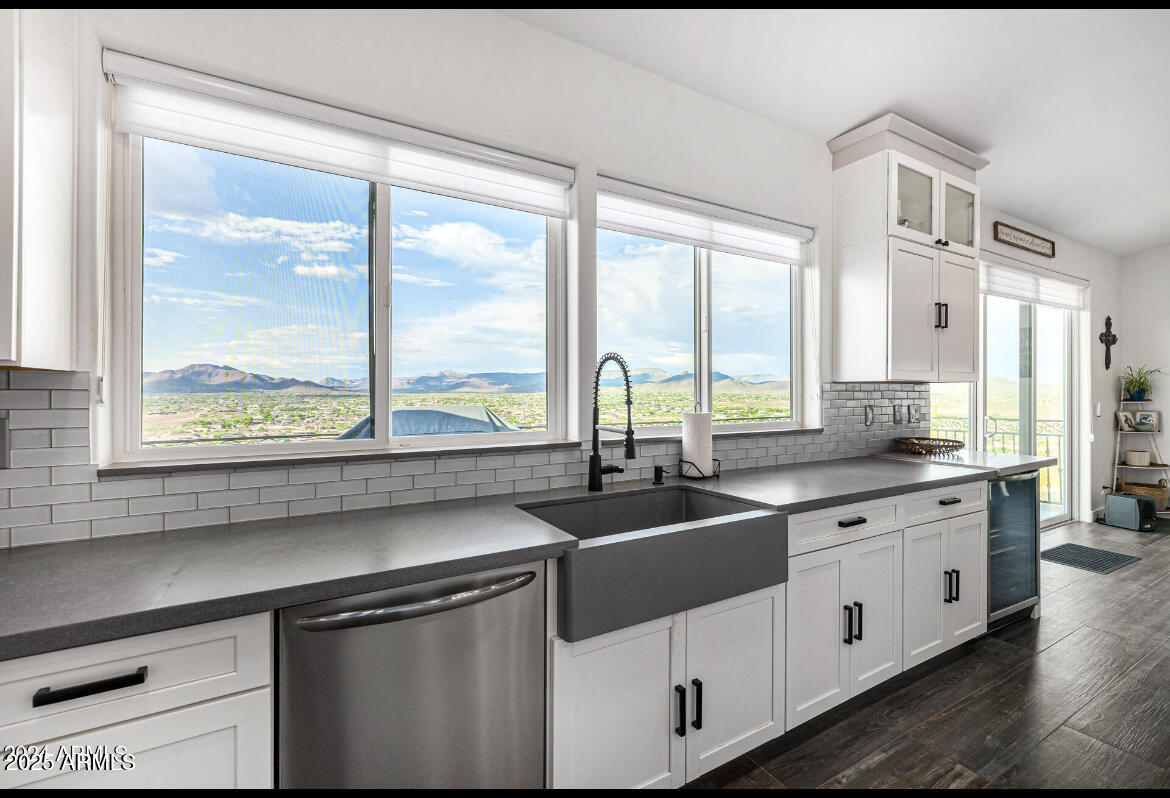 1829 West Cloud Road Phoenix, AZ 85086 - Photo 16 of 18 a kitchen with a sink and white cabinets