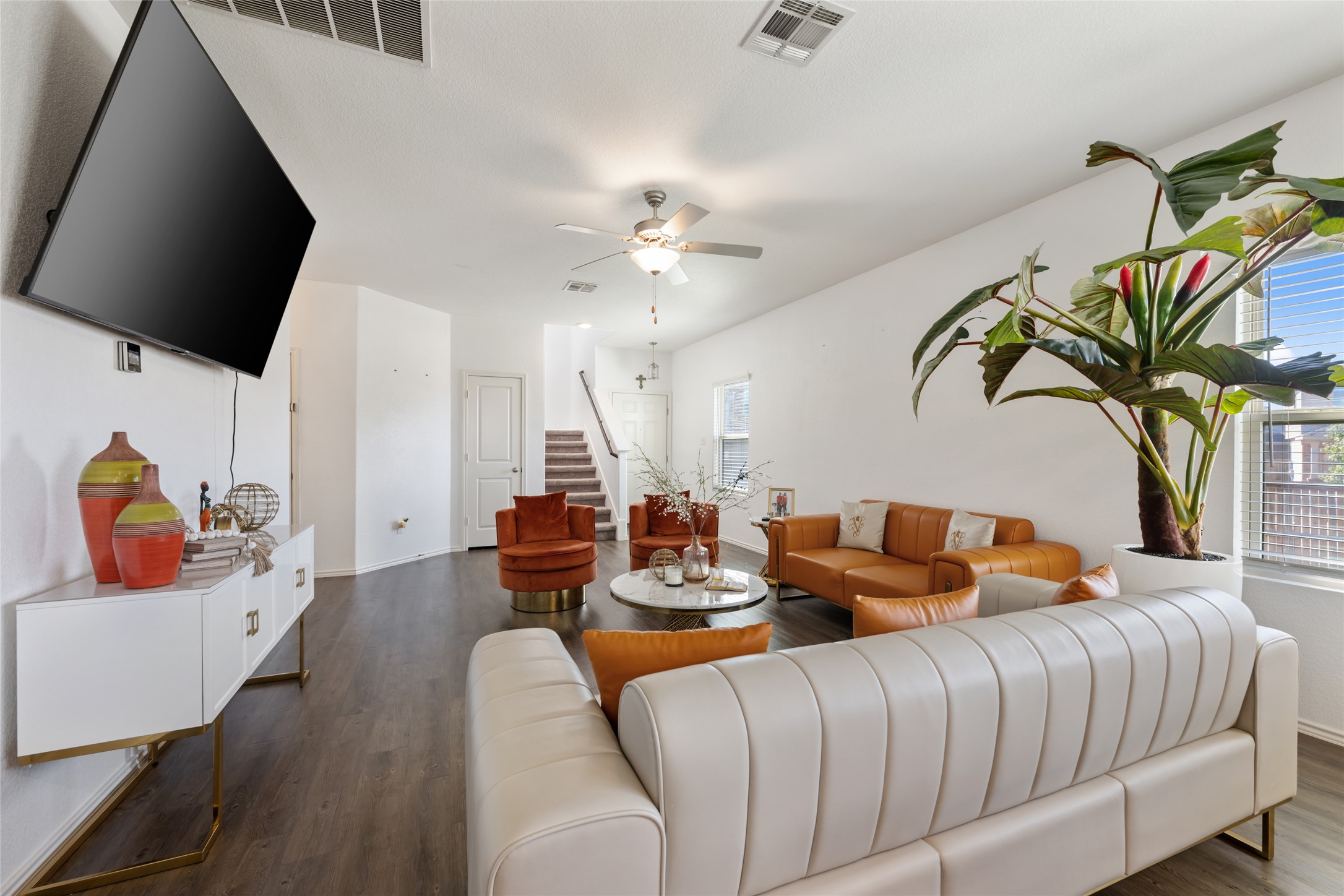 524 Circle Way, Unit 12F Jarrell, TX 76537 - Photo 6 of 34 Living area featuring a ceiling fan and dark wood-style floors