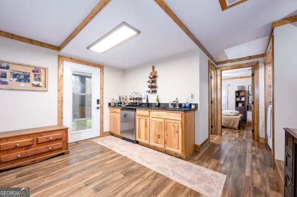a open kitchen with granite countertop a refrigerator and a stove top oven