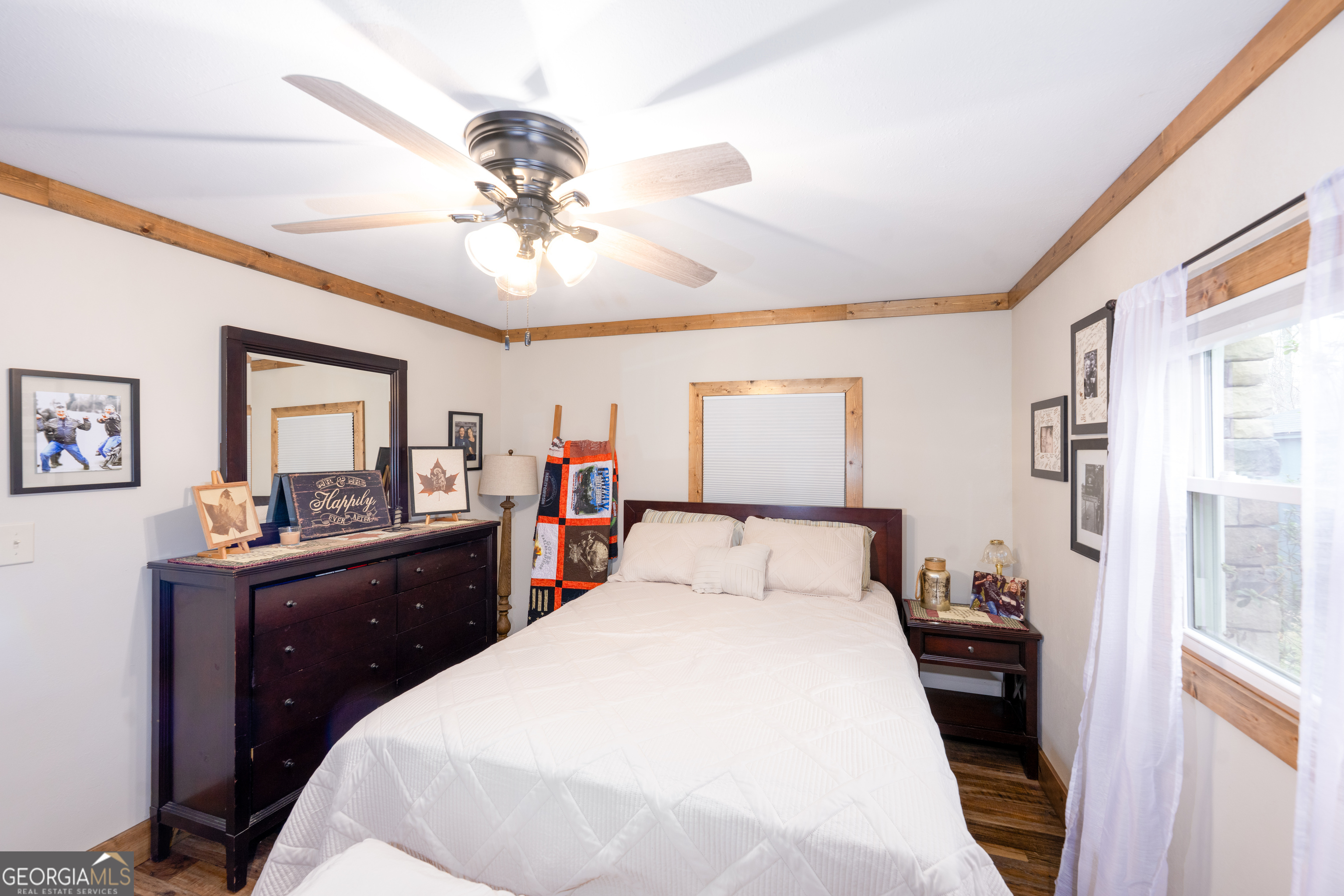 206 Hedden Road Murphy, NC 28906 - Photo 22 of 29 a bedroom with a large bed and a chandelier