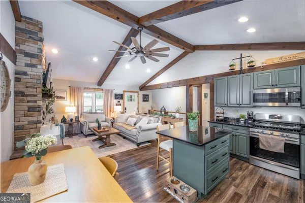 a living room with fireplace furniture and a flat screen tv