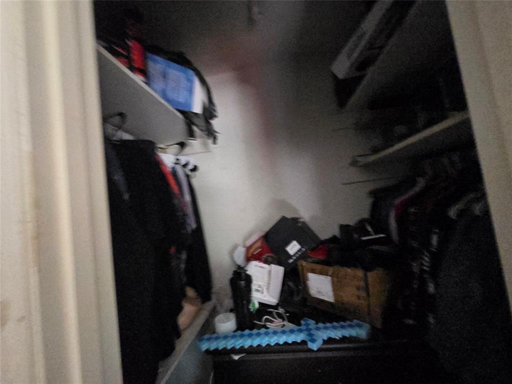 5082 Bennett Road Wylie, TX 75098 - Photo 17 of 26 a room with lots of different colored cloths