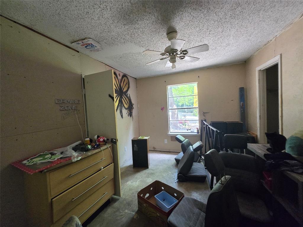 5082 Bennett Road Wylie, TX 75098 - Photo 20 of 26 a living room with furniture and a chandelier