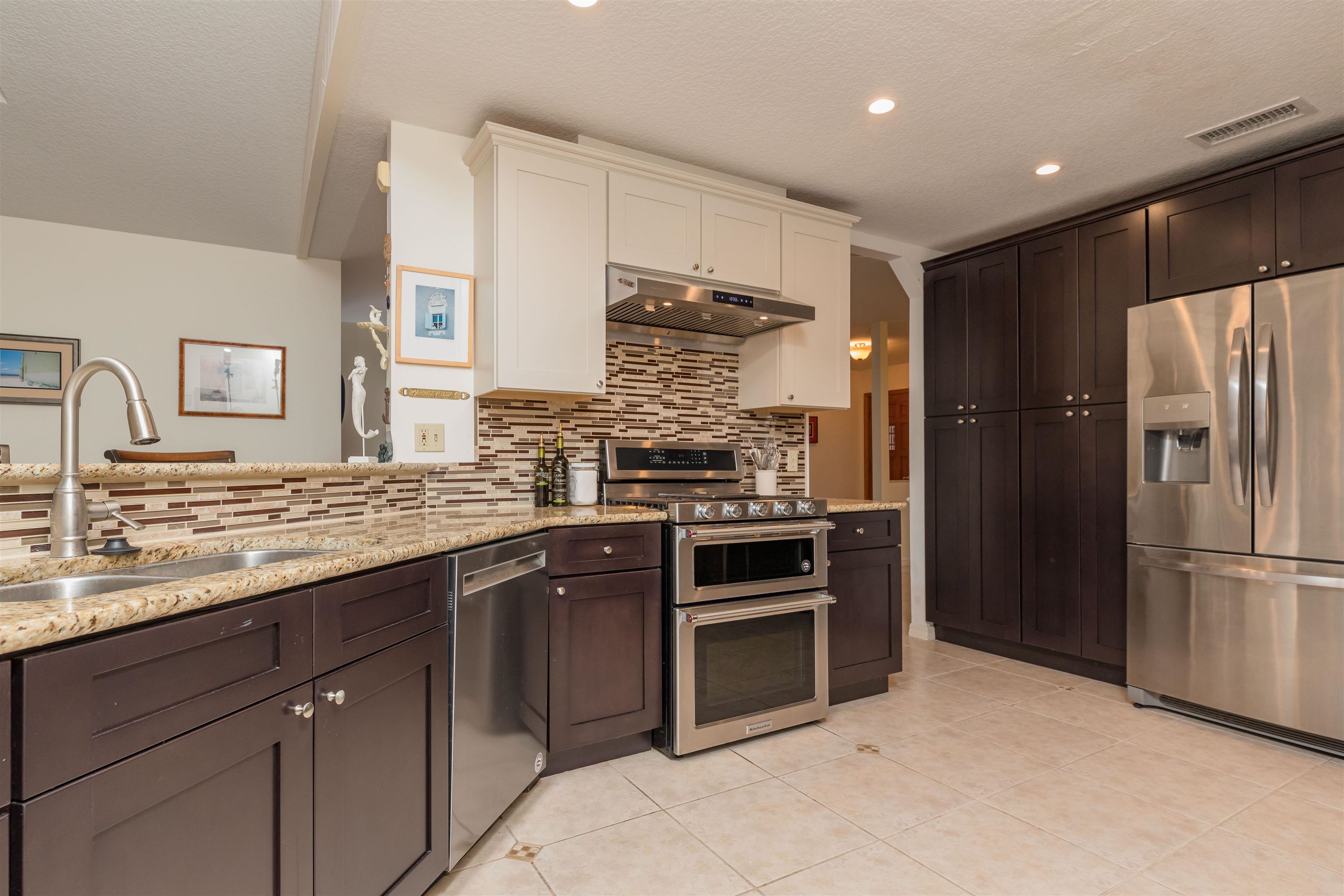 3224 Turtle Creek Road St. Augustine, FL 32086 - Photo 17 of 44 a kitchen with a refrigerator and a sink
