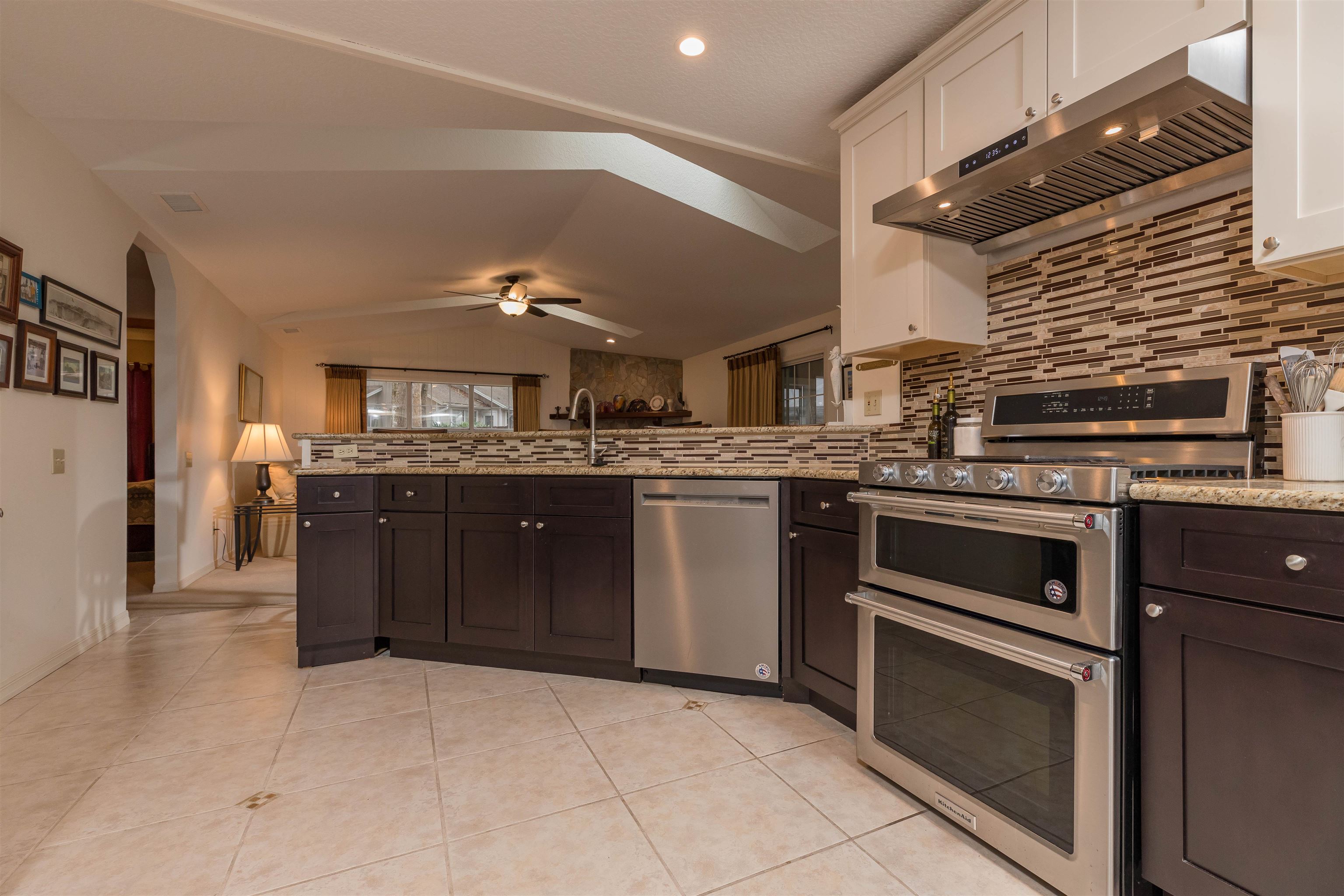 3224 Turtle Creek Road St. Augustine, FL 32086 - Photo 19 of 44 a kitchen with stainless steel appliances granite countertop a stove and a sink
