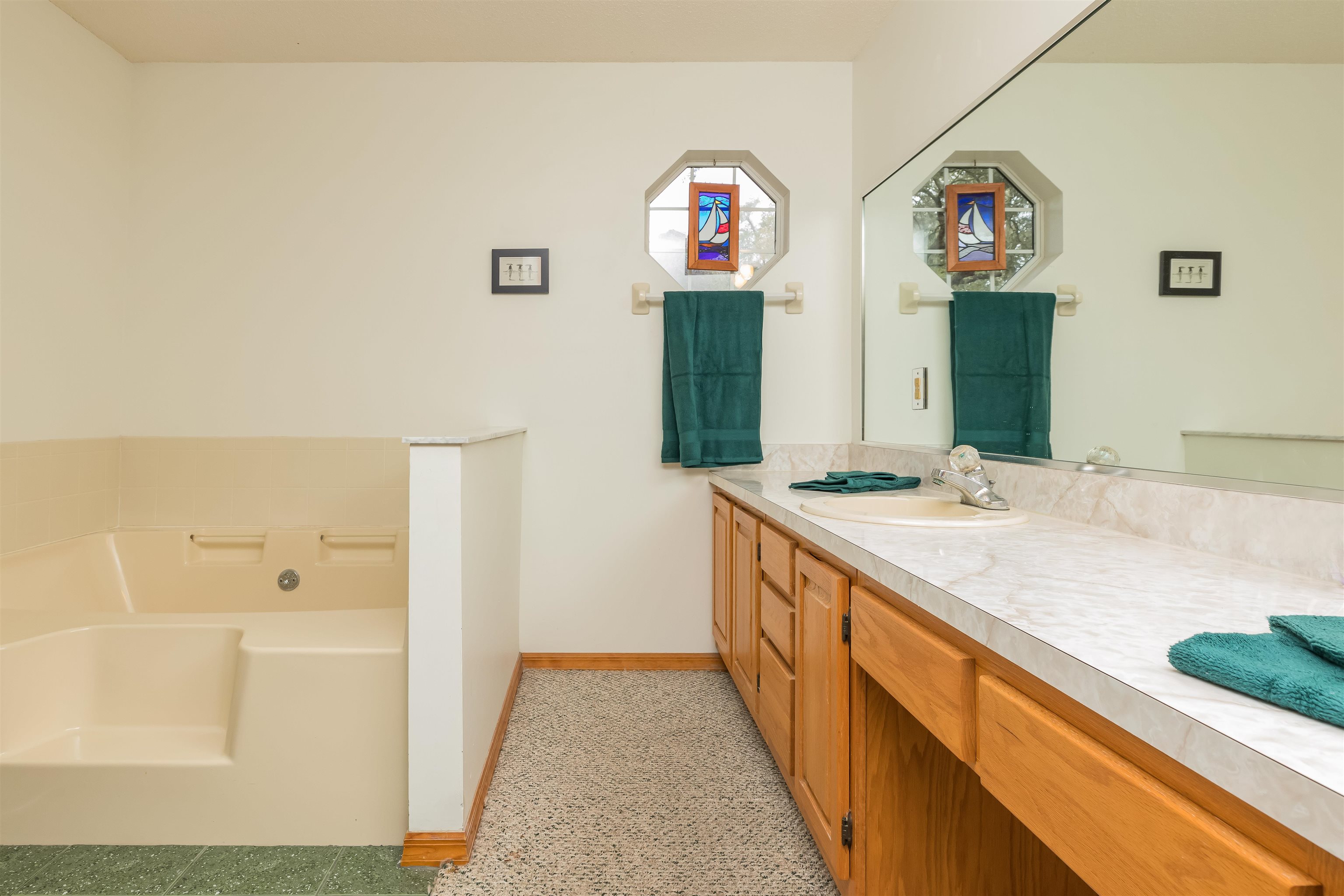 3224 Turtle Creek Road St. Augustine, FL 32086 - Photo 24 of 44 a bathroom with a sink and a mirror
