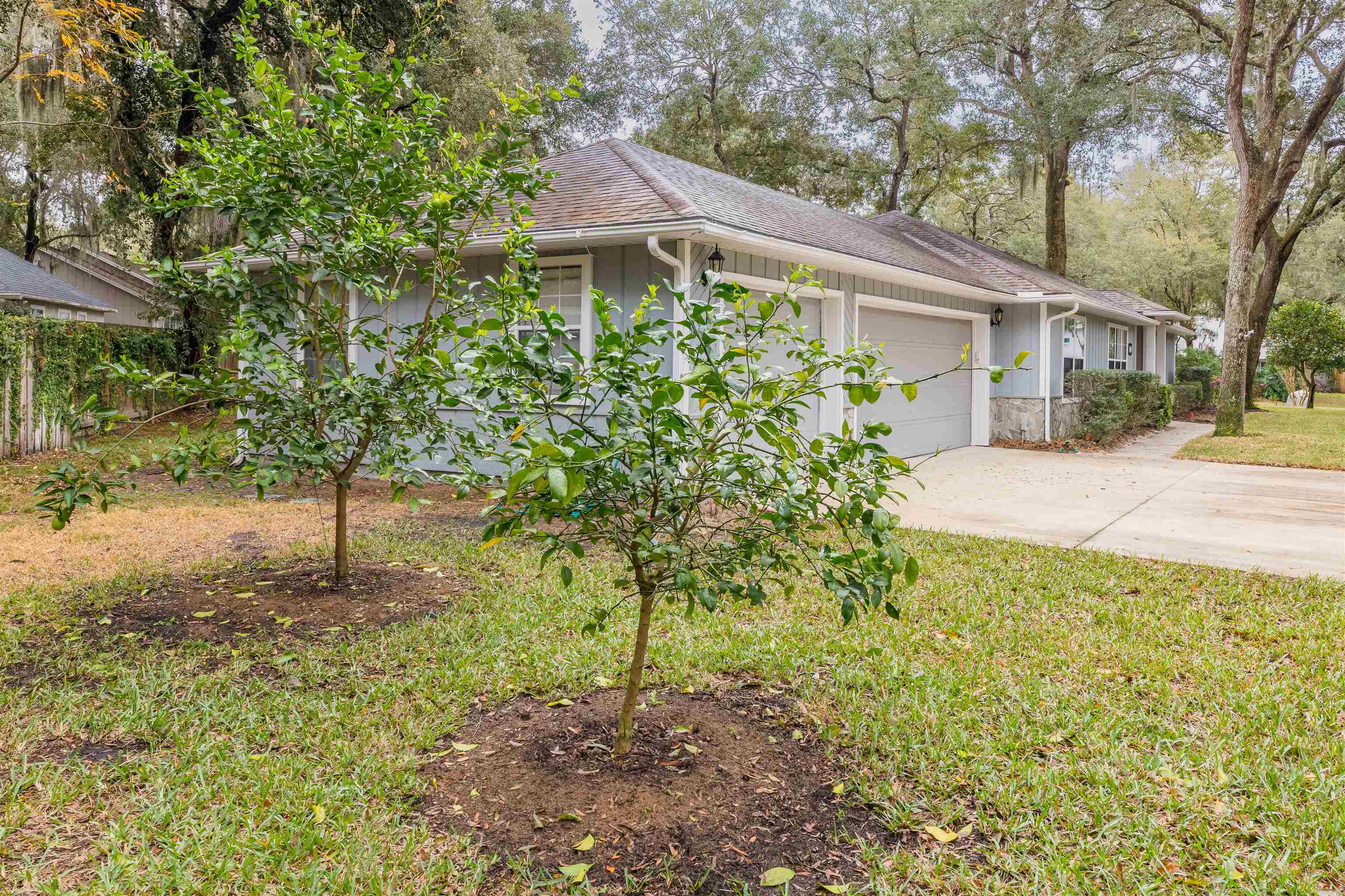 3224 Turtle Creek Road St. Augustine, FL 32086 - Photo 5 of 44 a front view of a house with a yard and garage