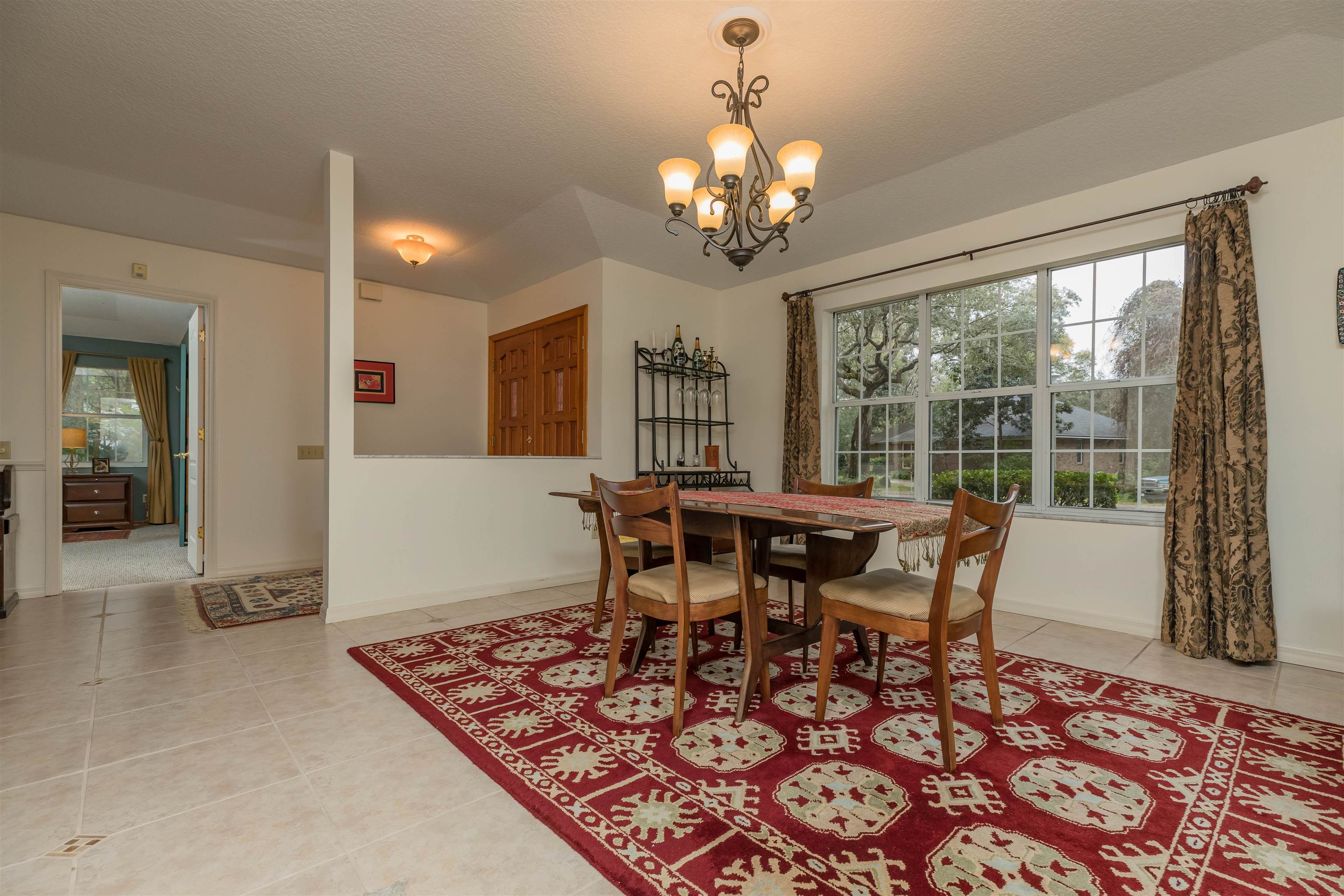 3224 Turtle Creek Road St. Augustine, FL 32086 - Photo 8 of 44 a view of a dining room with furniture window and wooden floor