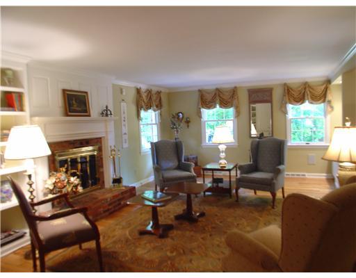 504 Beaver Road Edgeworth, PA 15143 - Photo 2 of 18 Living Room. handsome hardwood floors, fireplace, wine bar with refrigerator, built-in cabinetry and shelving