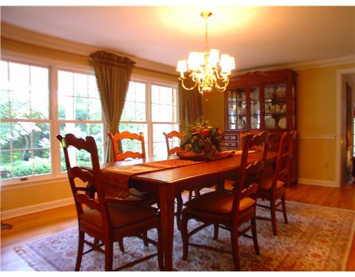 504 Beaver Road Edgeworth, PA 15143 - Photo 3 of 18 Dining Room. hardwood floors, wainscoating, bank of windows