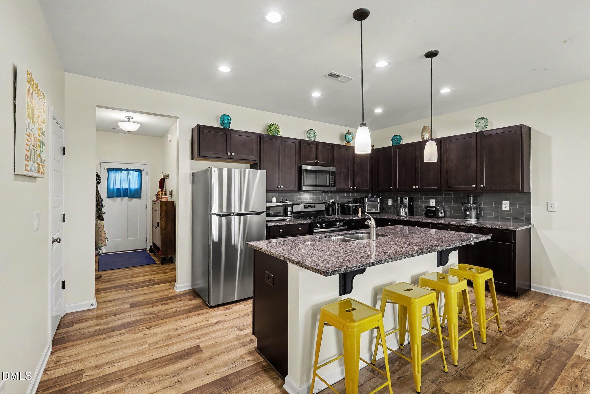 738 Putney Hill Road Zebulon, NC 27597 - Photo 7 of 24 Kitchen and Entry