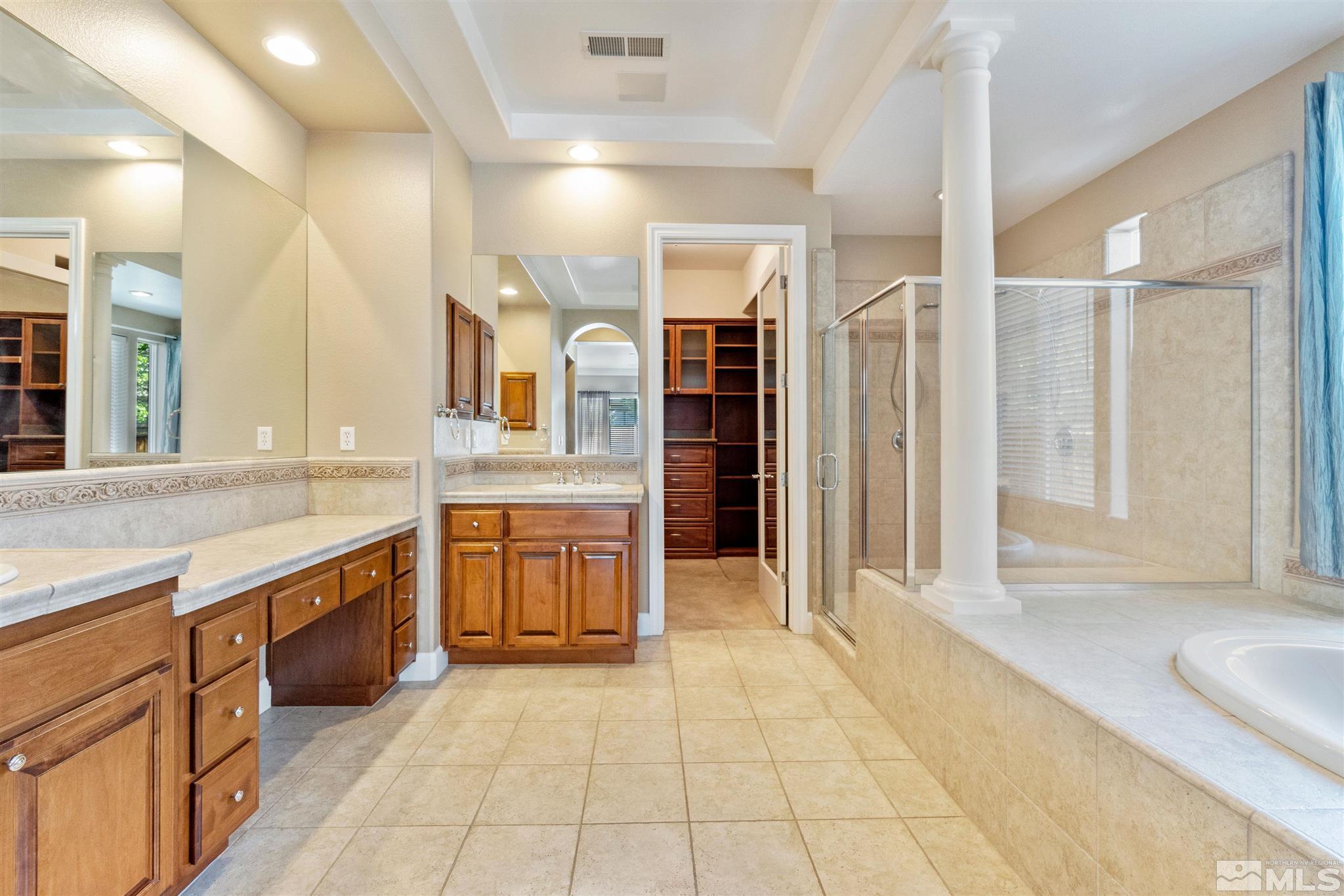 2630 Strathmore Court Reno, NV 89521 - Photo 17 of 40 a large bathroom with a large tub and sink