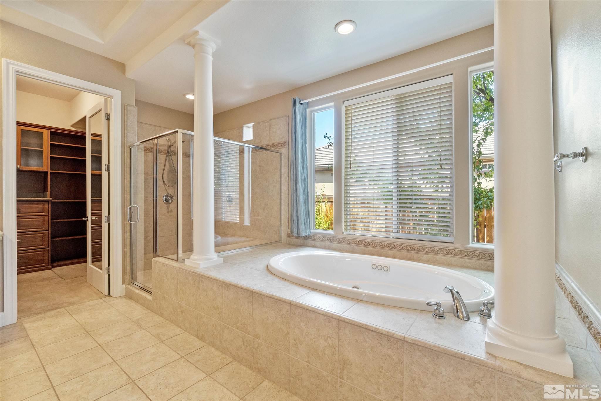 2630 Strathmore Court Reno, NV 89521 - Photo 18 of 40 a spacious bathroom with a tub shower and sink