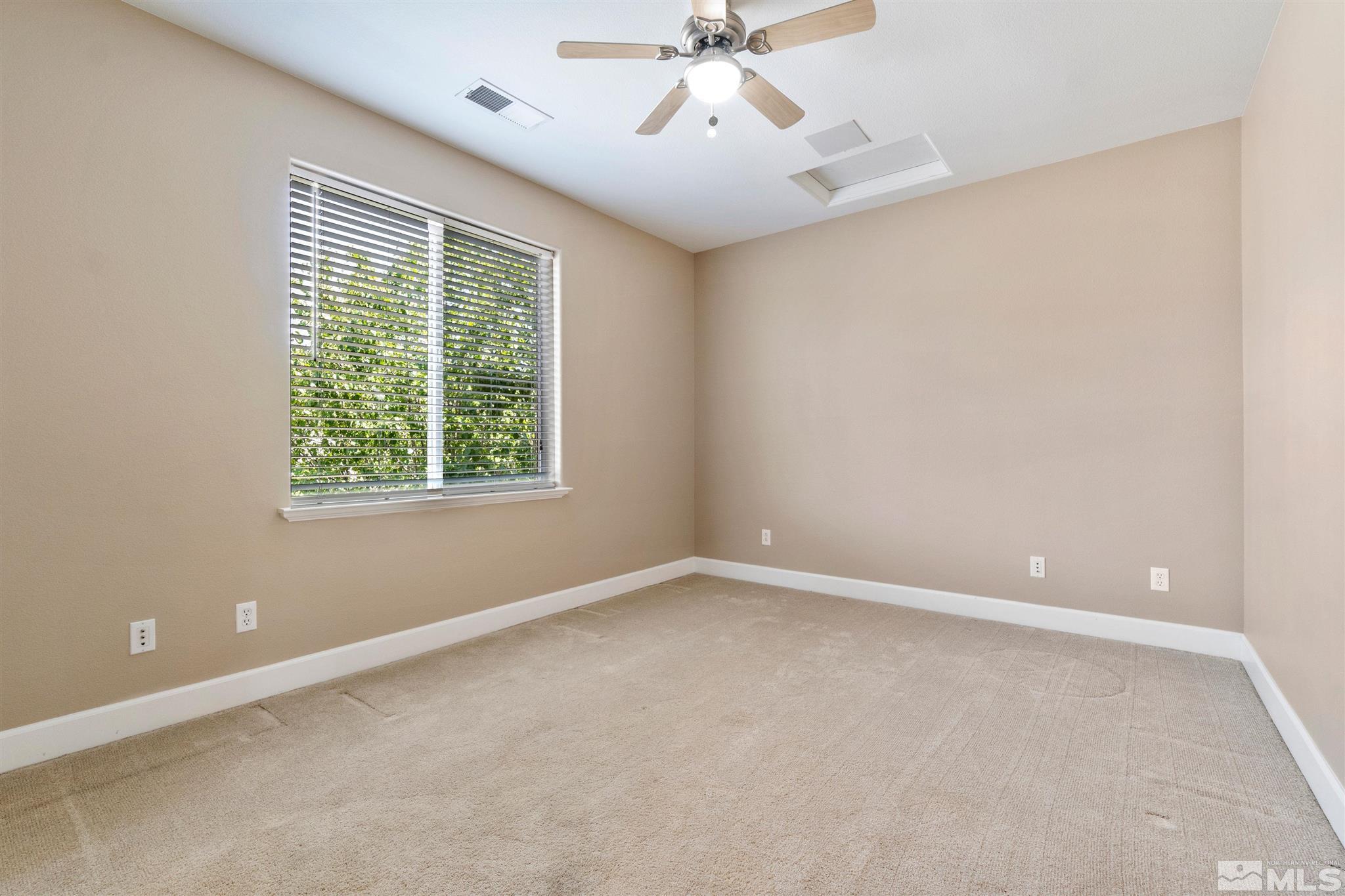 2630 Strathmore Court Reno, NV 89521 - Photo 33 of 40 an empty room with a window and a fan