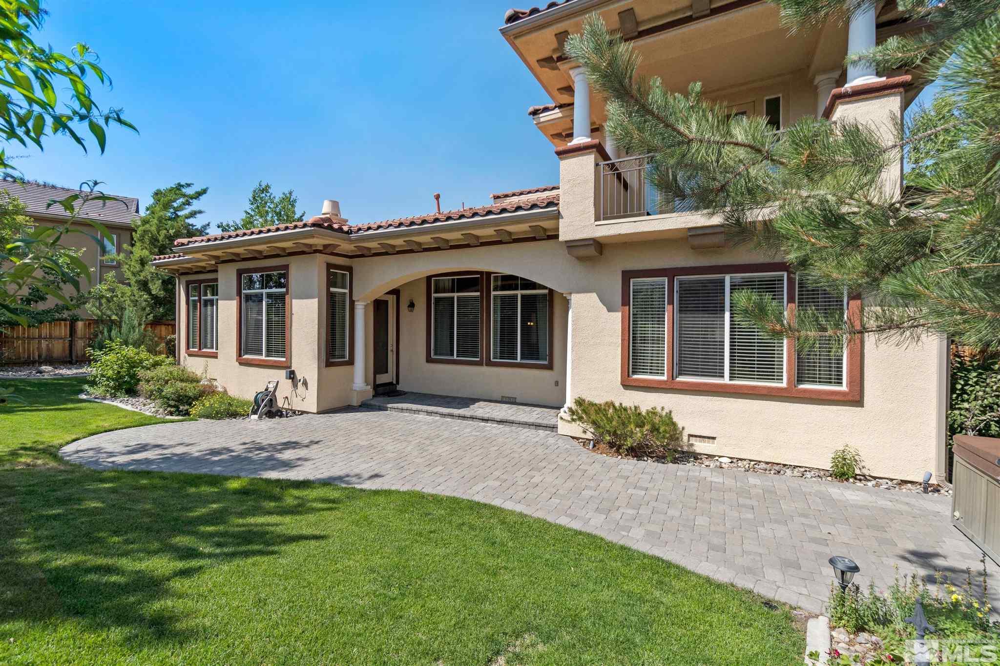 2630 Strathmore Court Reno, NV 89521 - Photo 38 of 40 a front view of a house with a garden and yard