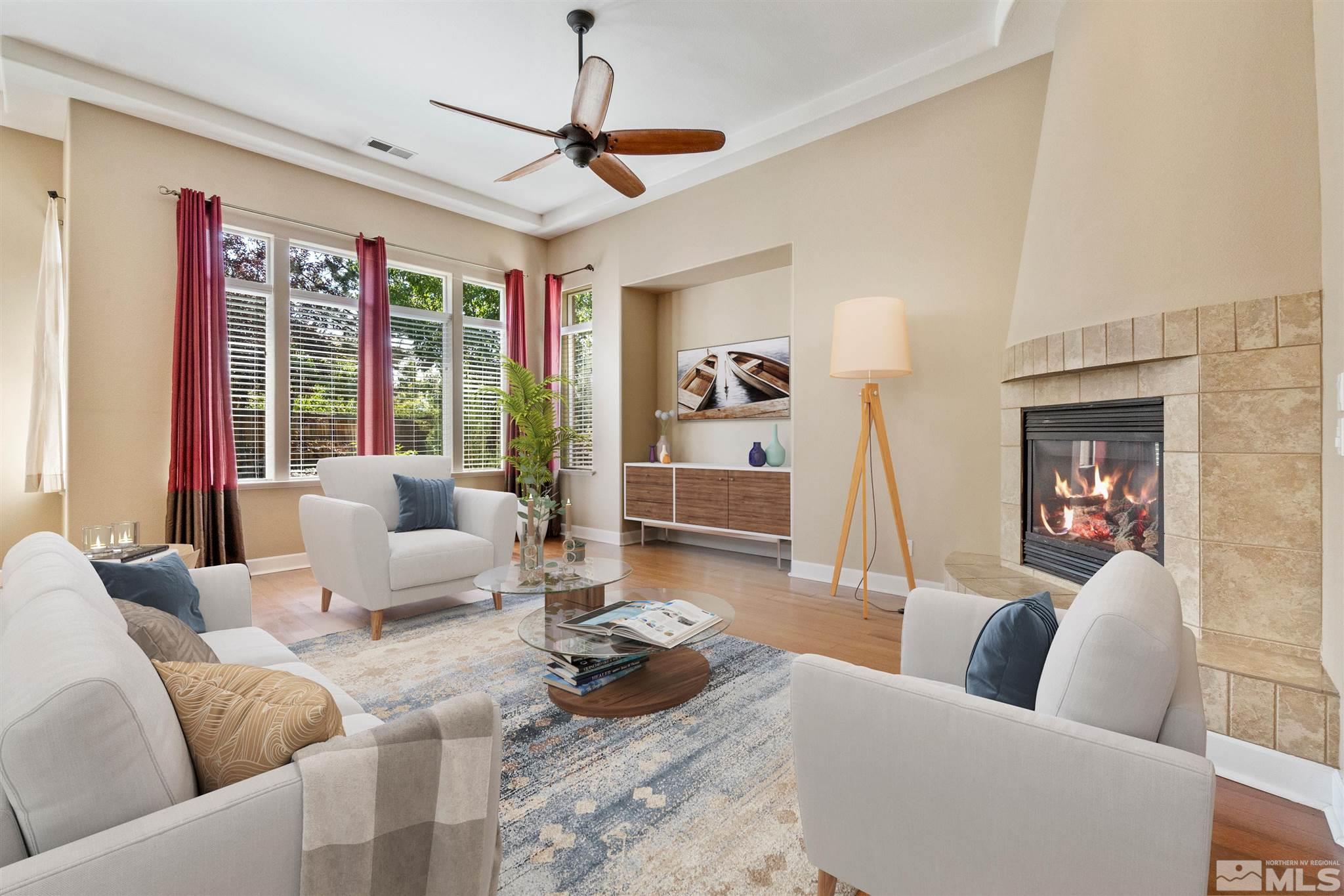 2630 Strathmore Court Reno, NV 89521 - Photo 6 of 40 a living room with furniture ceiling fan and a rug