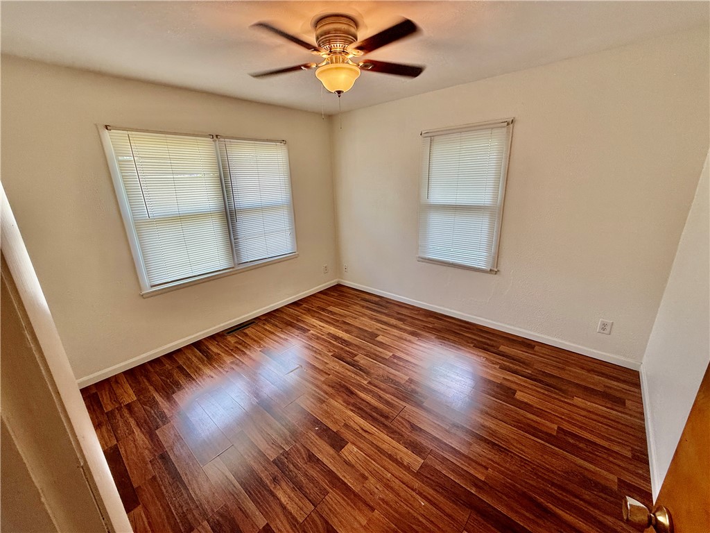 127 Isabella Drive Decatur, IL 62521 - Photo 7 of 16 a view of empty room with wooden floor and fan