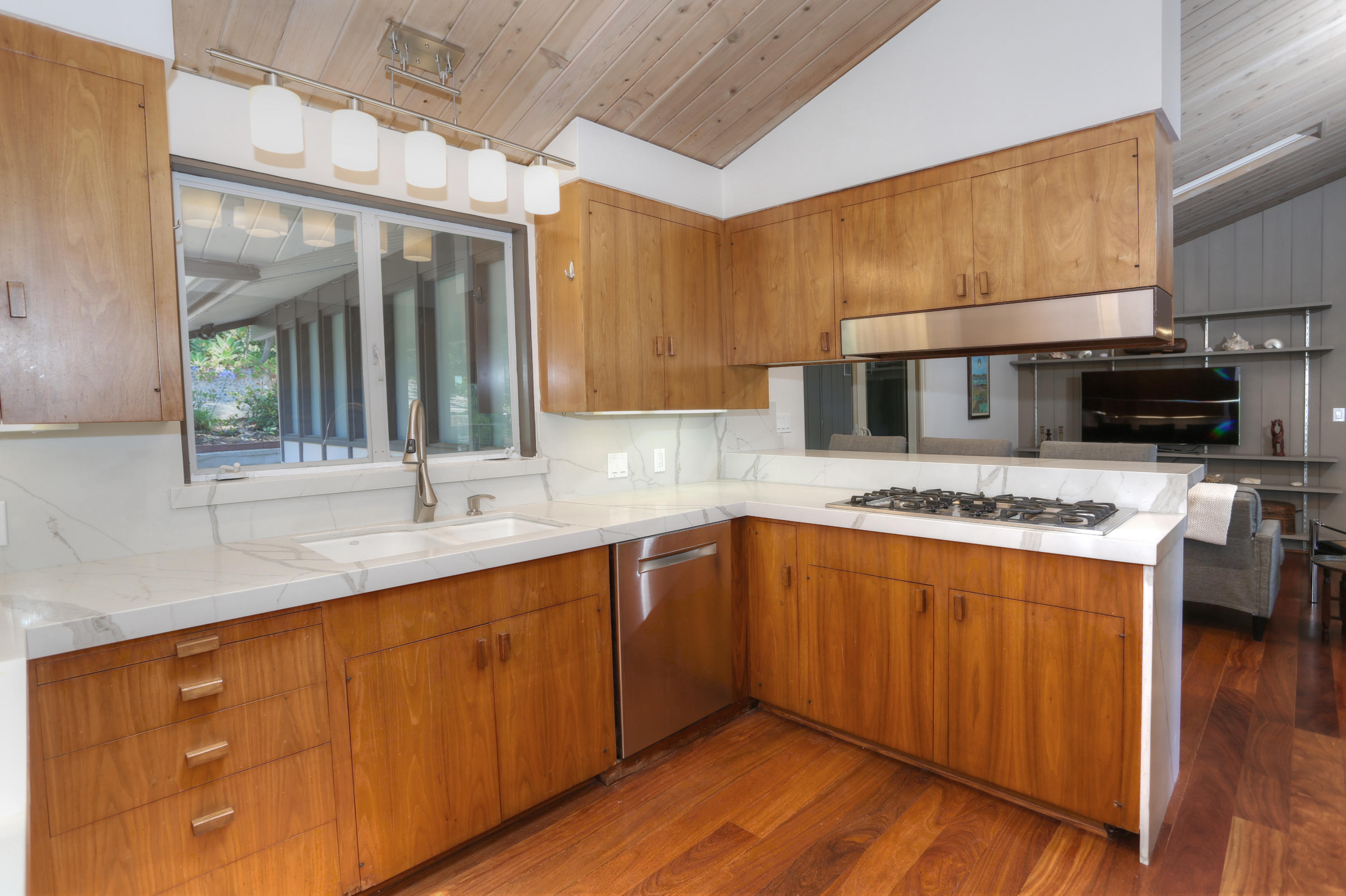 2261 Las Canoas Road Santa Barbara, CA 93105 - Photo 13 of 42 a kitchen with stainless steel appliances a sink a stove a microwave and wooden cabinets