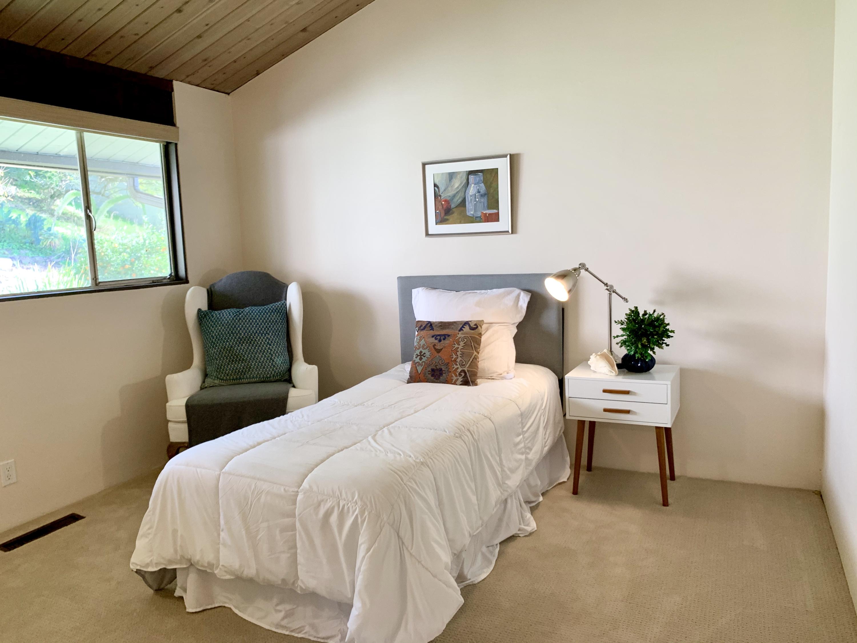 2261 Las Canoas Road Santa Barbara, CA 93105 - Photo 24 of 42 a bedroom with a bed and a window