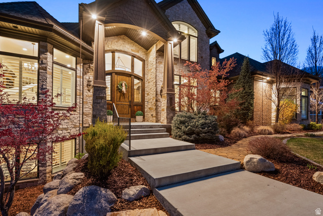 1205 North Elk Rdg Lane, Unit 202 Alpine, UT 84004 - Photo 81 of 88 Stone and siding exterior with a prominent arched wooden entry door