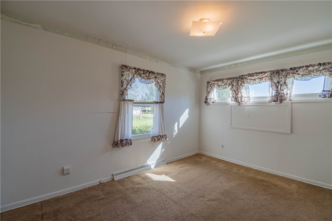 2287 West Cushing Street Decatur, IL 62526 - Photo 8 of 23 an empty room with windows and closet