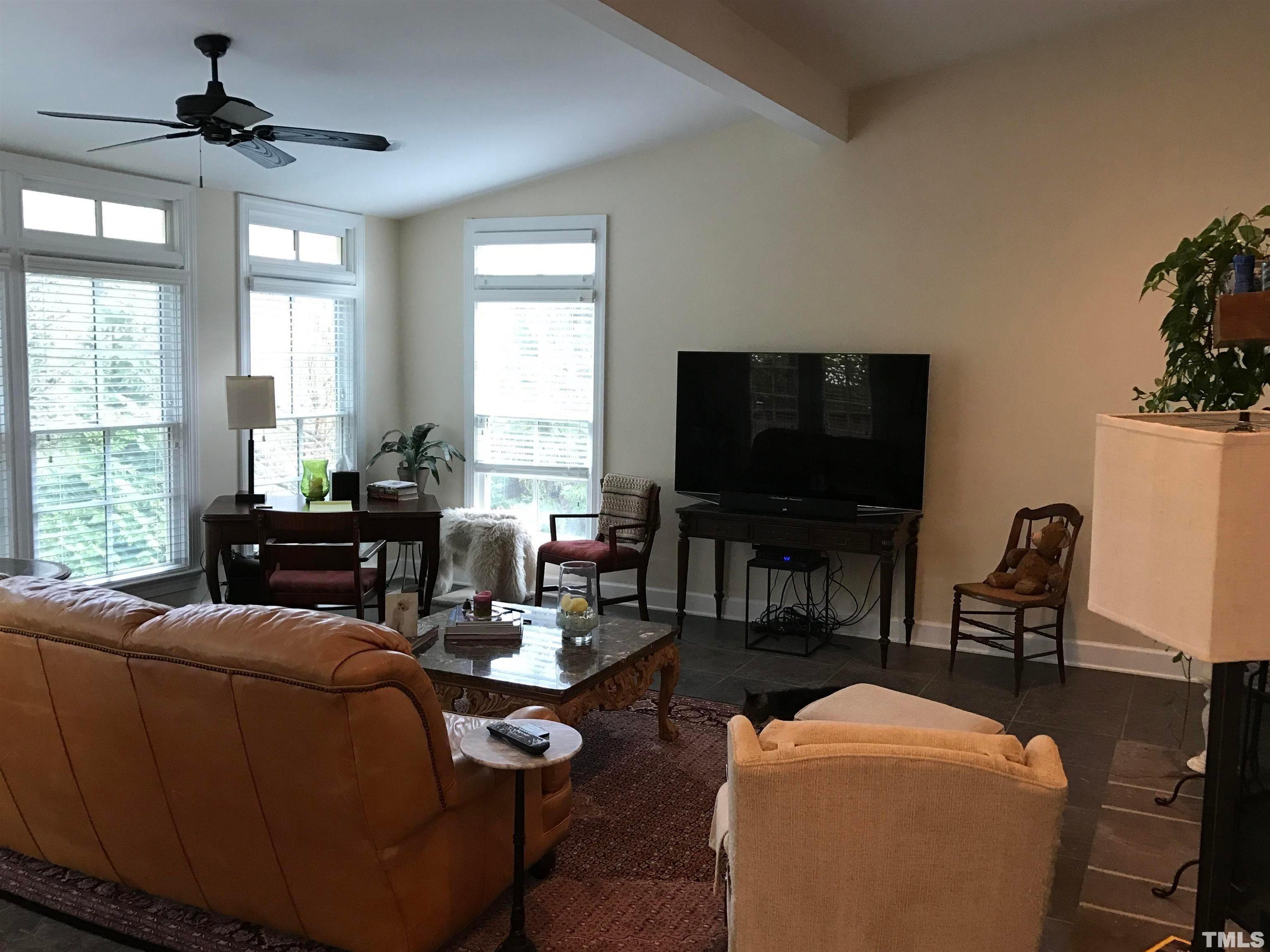 3309 Darien Drive Raleigh, NC 27607 - Photo 4 of 7 a living room with furniture and a flat screen tv