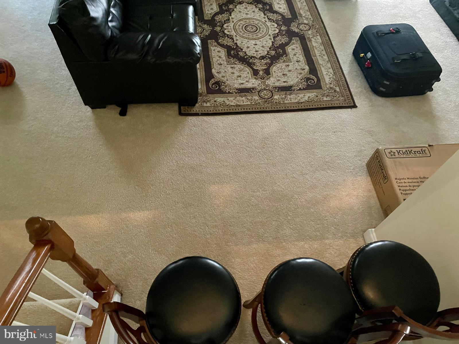 22225 Falling Terrace Ashburn, VA 20148 - Photo 14 of 30 a living room with a chair and a wooden floor