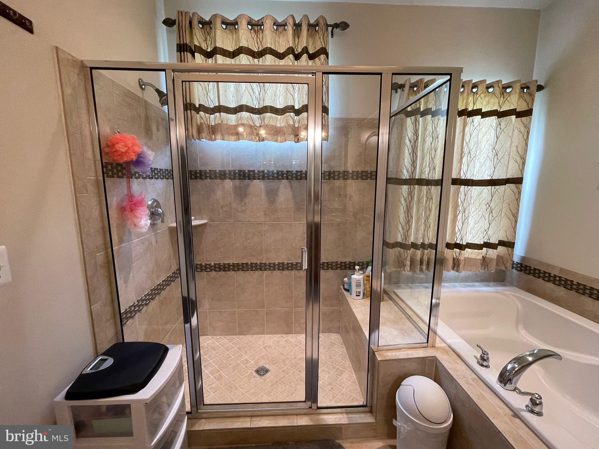 22225 Falling Terrace Ashburn, VA 20148 - Photo 25 of 30 a bathroom with a granite countertop sink and a mirror