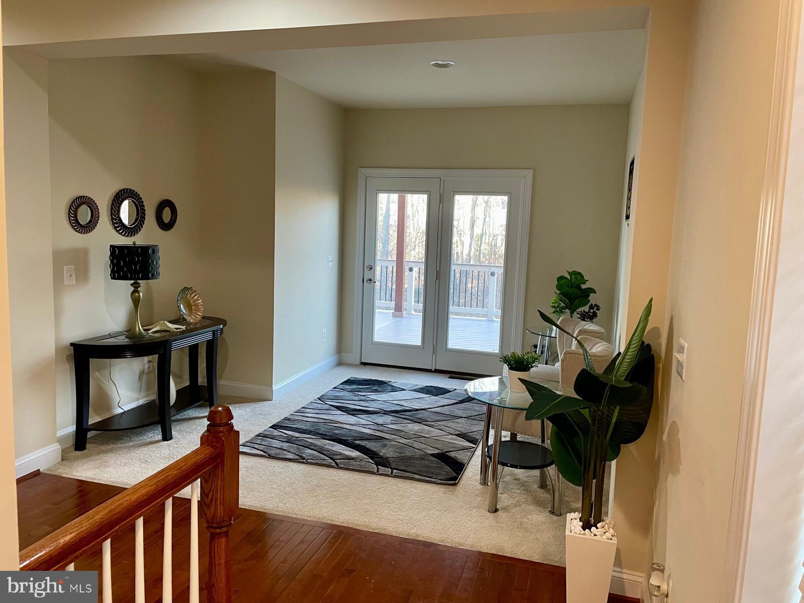 22225 Falling Terrace Ashburn, VA 20148 - Photo 5 of 30 a living room with furniture wooden floor and a window
