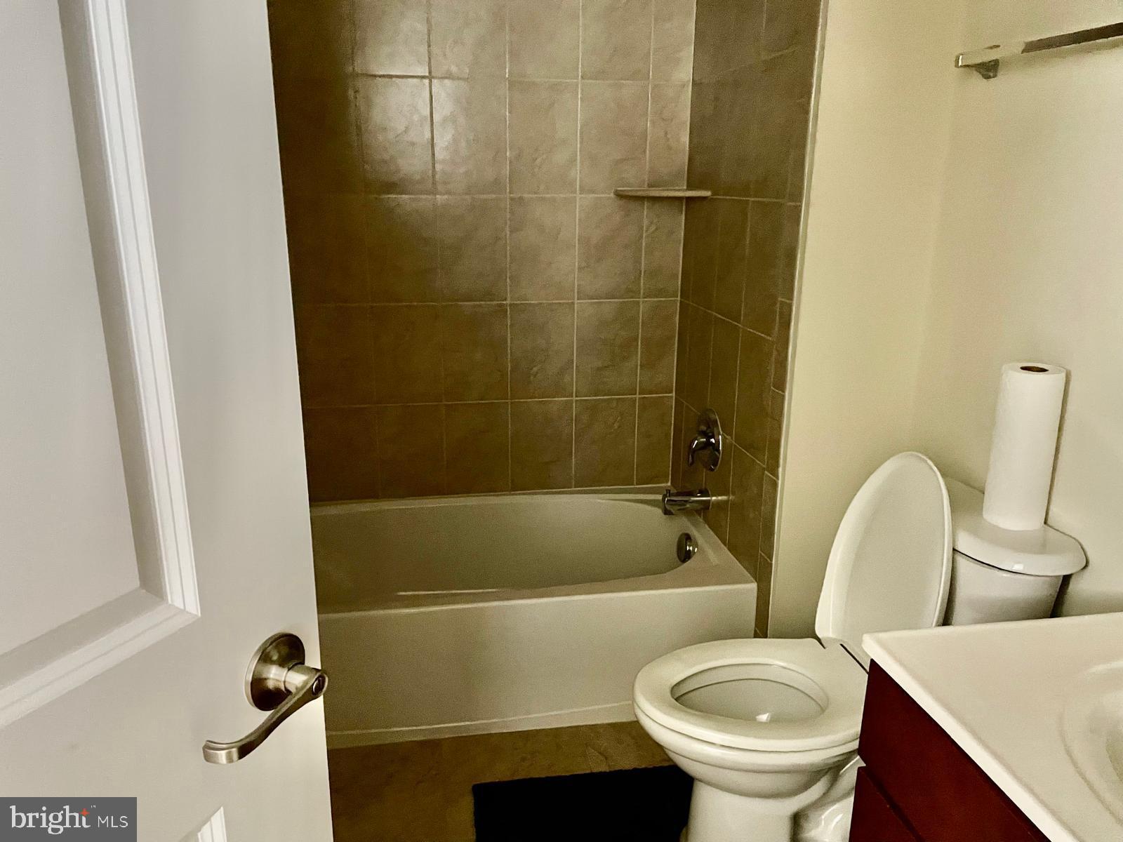 22225 Falling Terrace Ashburn, VA 20148 - Photo 8 of 30 a bathroom with a sink a toilet and a bathtub