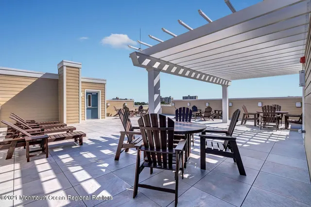 a view of a dining space with furniture and outdoor space