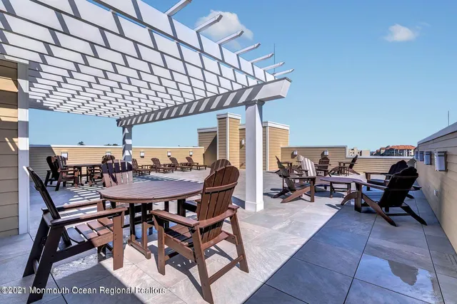 a view of a patio with table and chairs and potted plants