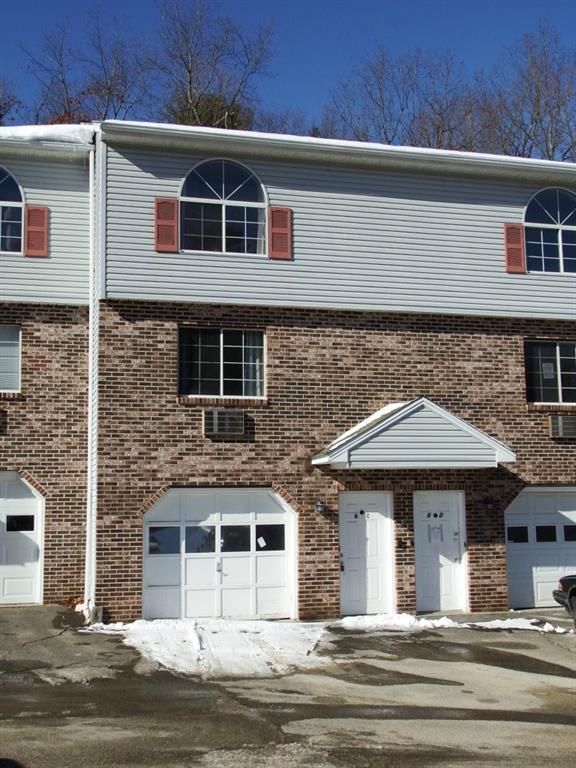 197 Pine Hill Road, Unit 6C Thomaston, CT 06787 - Photo 1 of 1 a front view of a house with a yard
