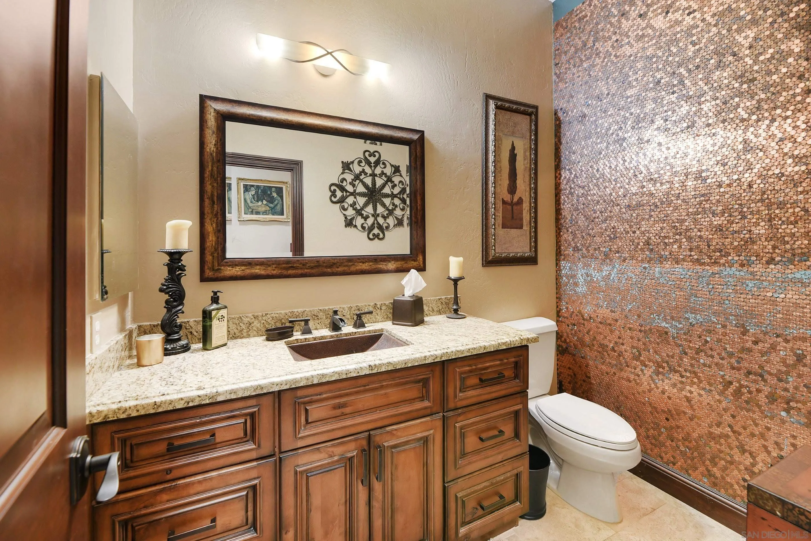 12963 Glen Circle Road Poway, CA 92064 - Photo 25 of 75 a bathroom with a granite countertop toilet sink and mirror