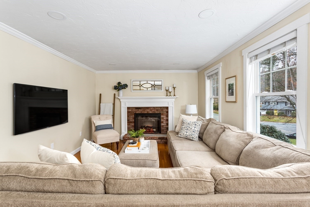 7 Glenwood Road Franklin, MA 02038 - Photo 14 of 46 a living room with furniture and a fireplace