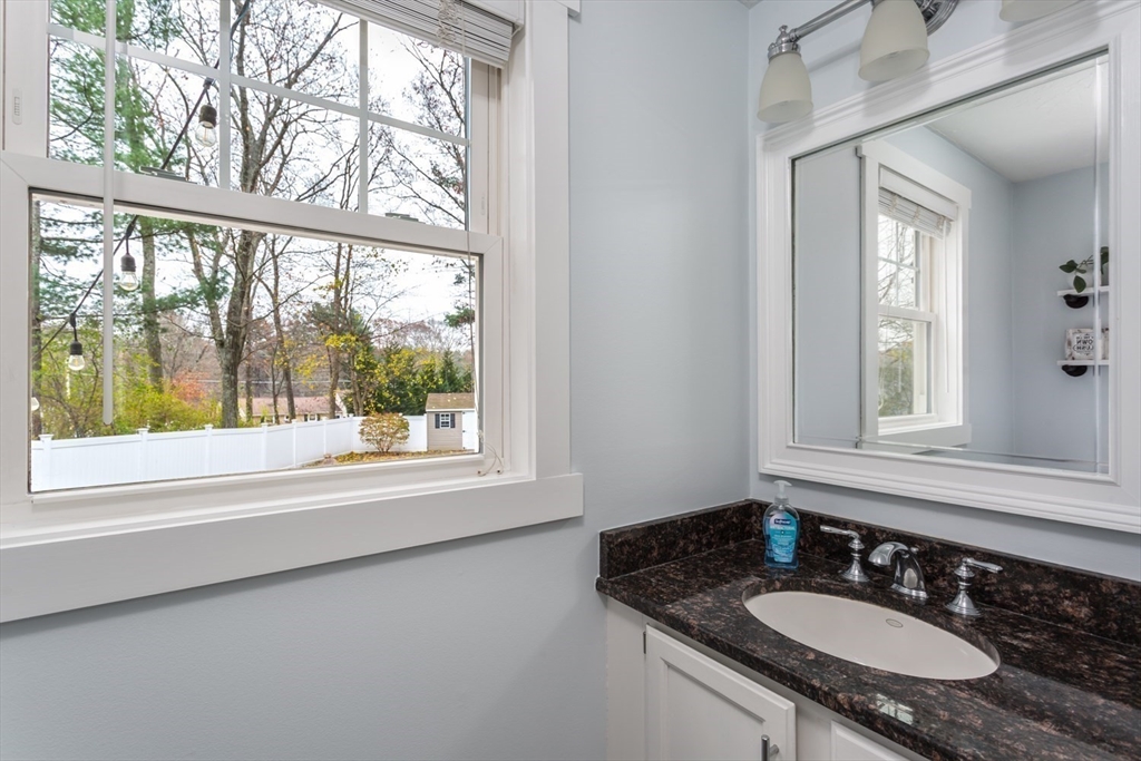 7 Glenwood Road Franklin, MA 02038 - Photo 19 of 46 a bathroom with a granite countertop sink and a mirror