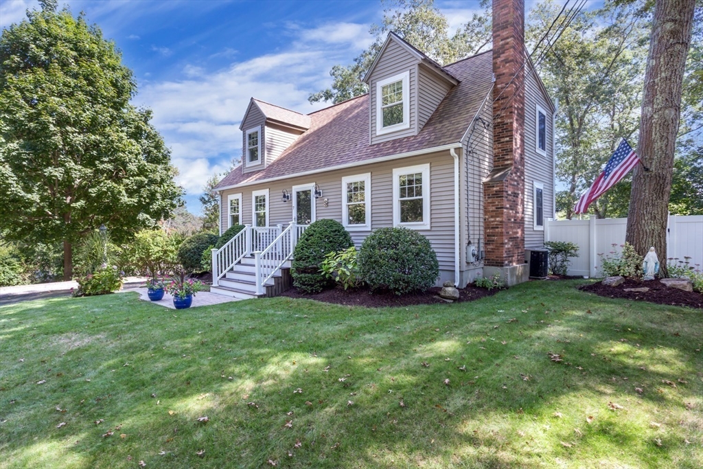 7 Glenwood Road Franklin, MA 02038 - Photo 40 of 46 a view of a house with a big yard and potted plants