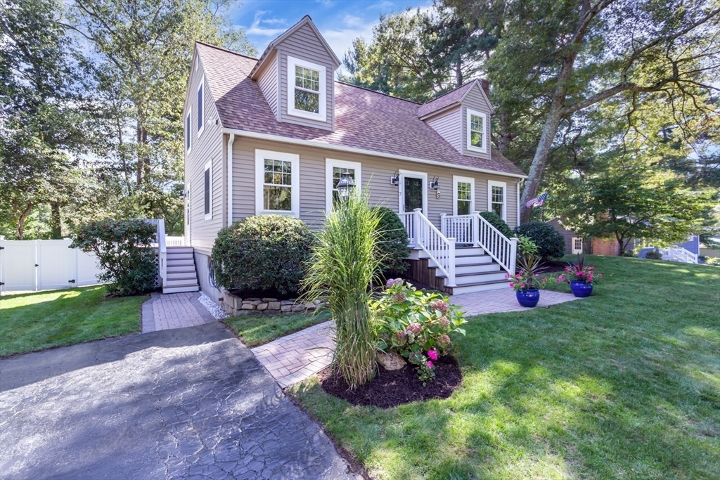7 Glenwood Road Franklin, MA 02038 - Photo 41 of 46 a front view of a house with a garden and plants