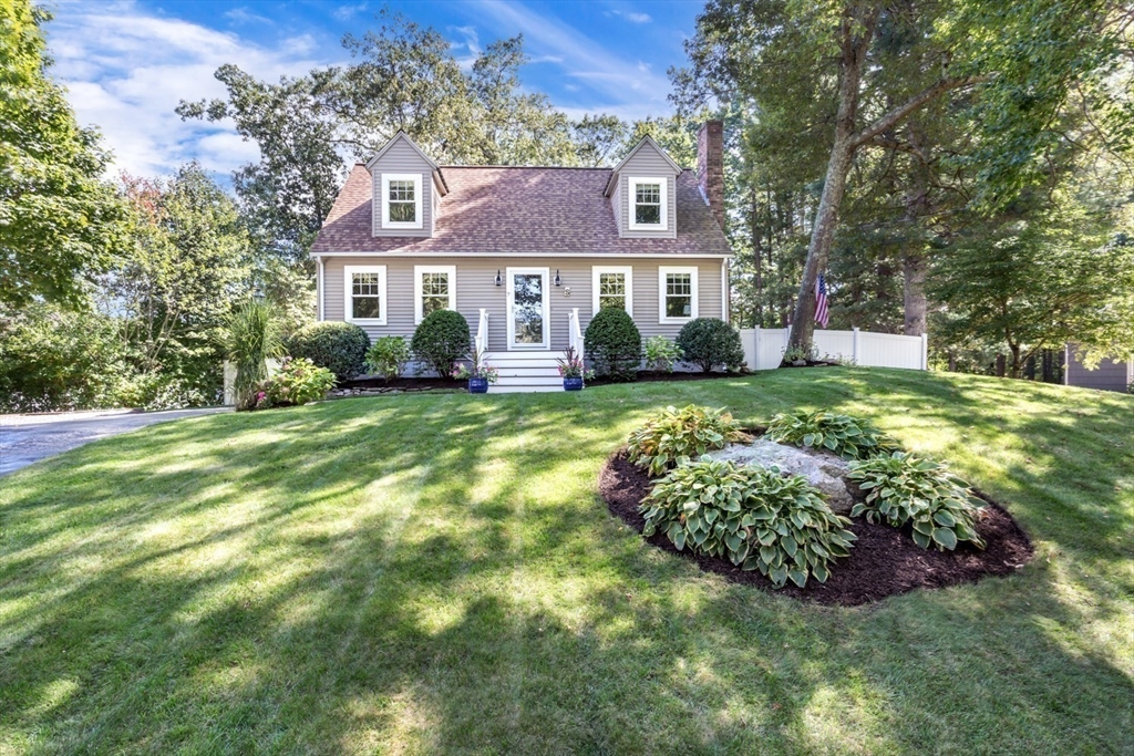 7 Glenwood Road Franklin, MA 02038 - Photo 42 of 46 a view of a brick house with a big yard and potted plants
