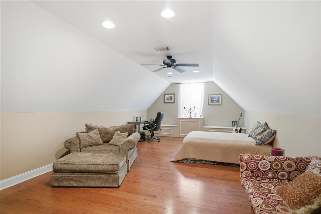 215 Inlet Pointe Drive Anderson, SC 29625 - Photo 19 of 47 This Bonus room features rich hardwood flooring and a bright window, creating a serene environment.