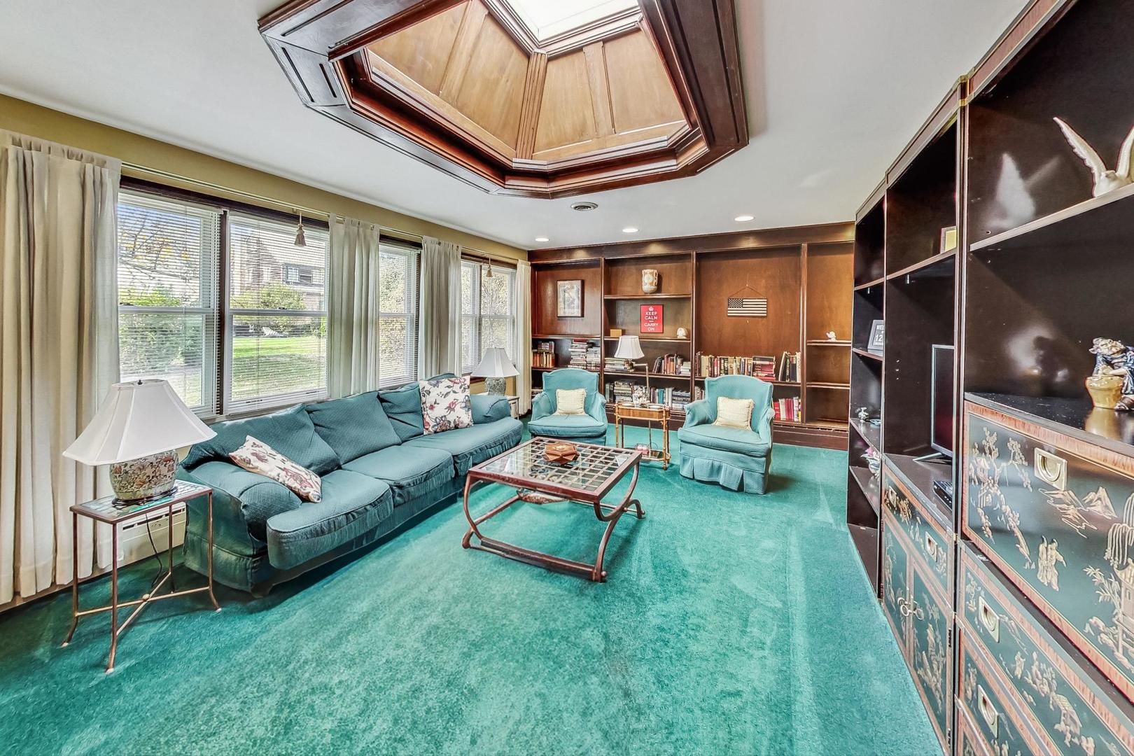 701 East Avenue Park Ridge, IL 60068 - Photo 8 of 37 a living room with furniture and a large window