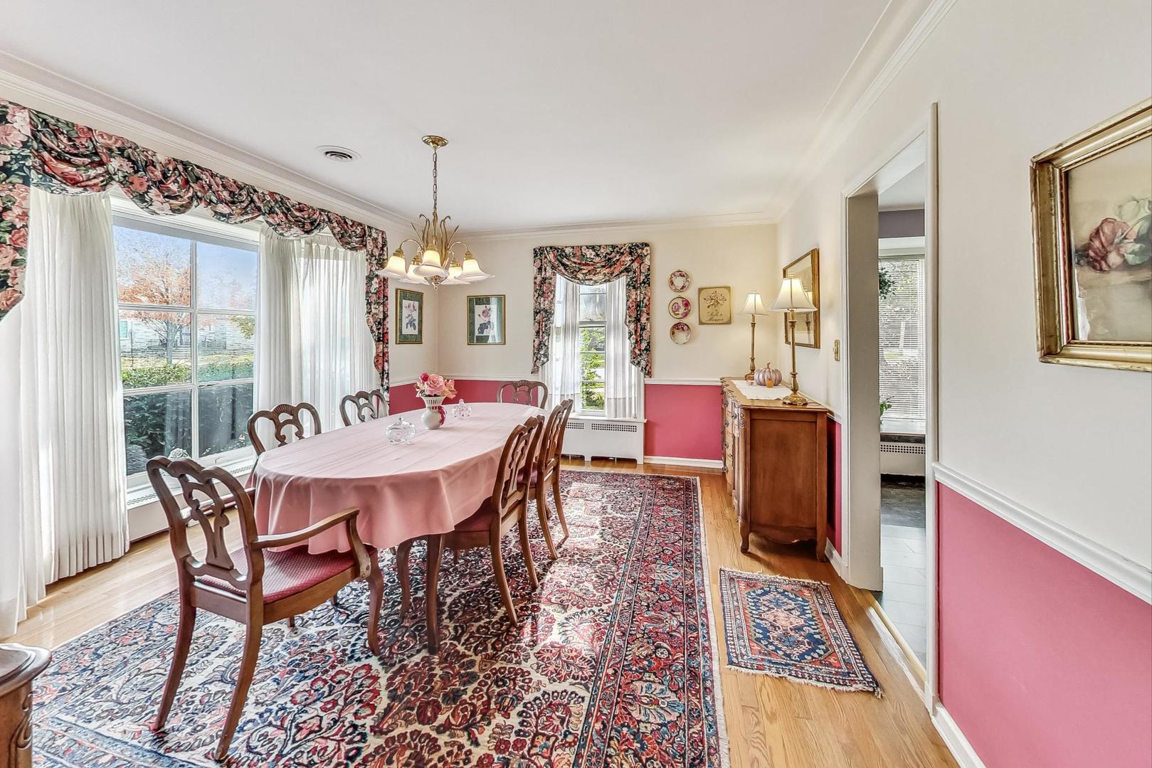 701 East Avenue Park Ridge, IL 60068 - Photo 10 of 37 a dining room with furniture a rug a rug and a chandelier