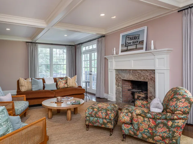 a living room with furniture and a fireplace