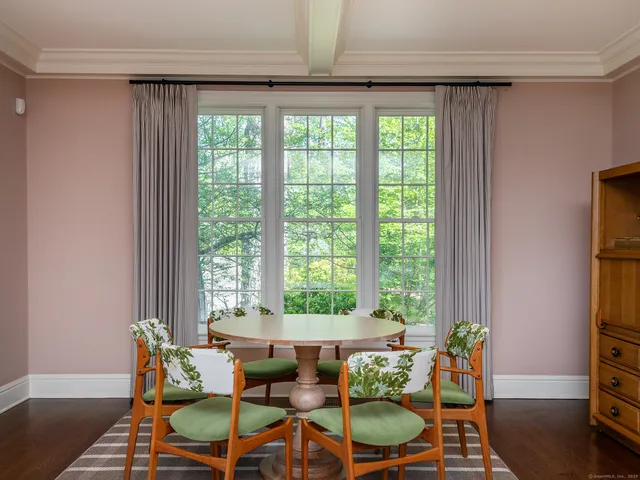 a dining room with furniture and window