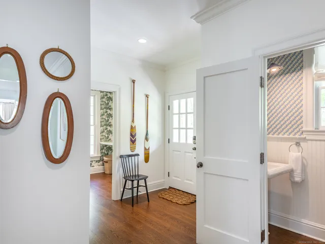 a view of a livingroom with furniture and a window