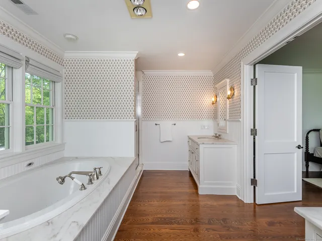 a bathroom with a bathtub and a shower